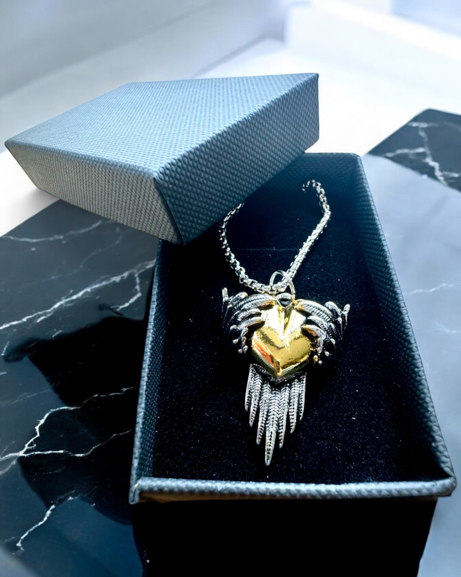 "Heartpiercer Amulet – Dark Wings of Love", personalization option with engraving for a gift.        4o