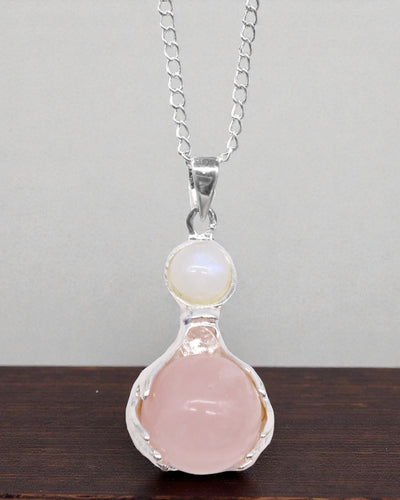Crystal Hands – Pendant of Healing Hands in Rose Quartz
