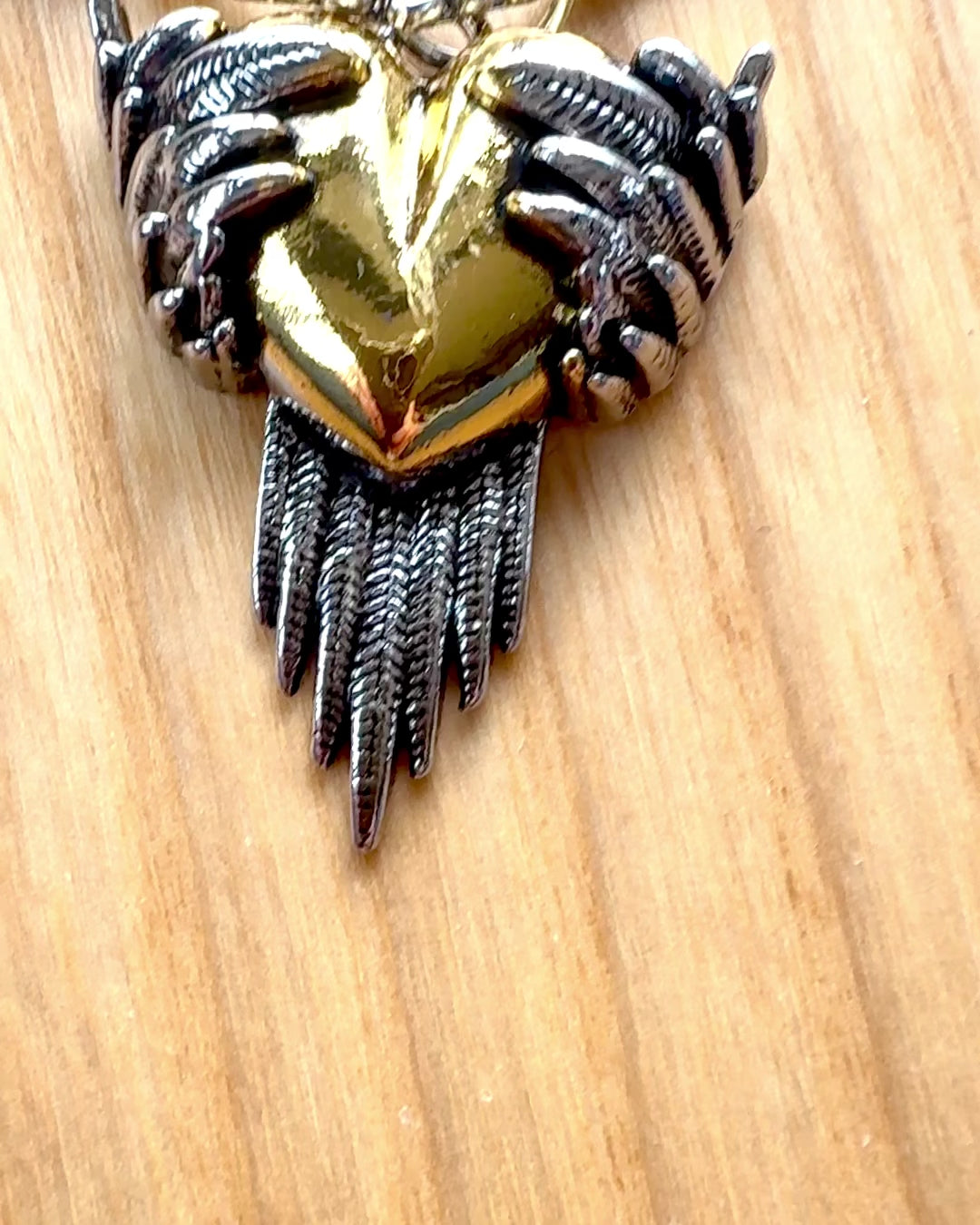 "Heartpiercer Amulet – Dark Wings of Love", personalization option with engraving for a gift.        4o