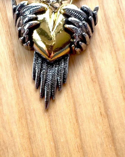 "Heartpiercer Amulet – Dark Wings of Love", personalization option with engraving for a gift.        4o