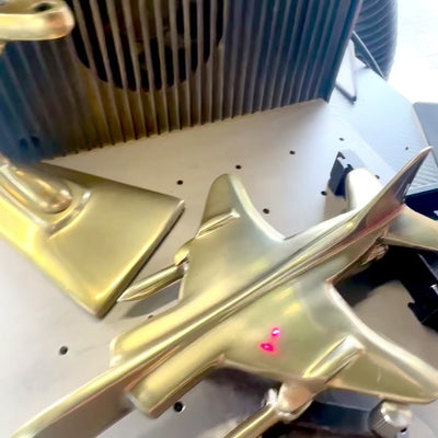 Golden-colored metal Jaguar fighter model with engraving option
